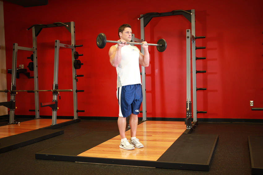 Curl invertido com barra — posição final